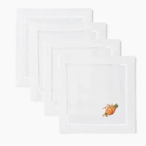 Henry Handwork white linen cocktail napkins with hemstitch border and embroidered pumpkin.
