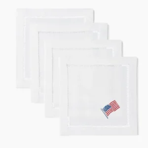 Henry Handwork Stars & Stripes white linen cocktail napkins with hemstitch border and American flag embroidery.