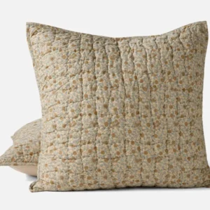 Coyuchi Blossom Handstitched pillow sham in amber and sage floral quilted cotton.